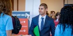 Man in suit at a career fair