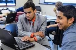 Two students sitting at computer